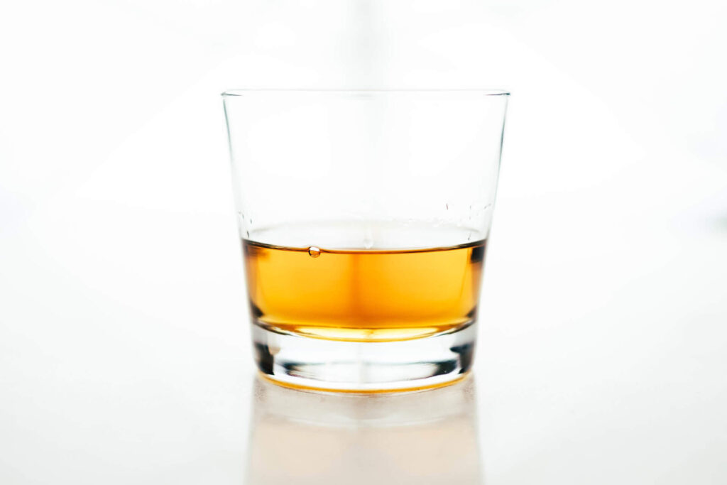 a glass of brown liquid