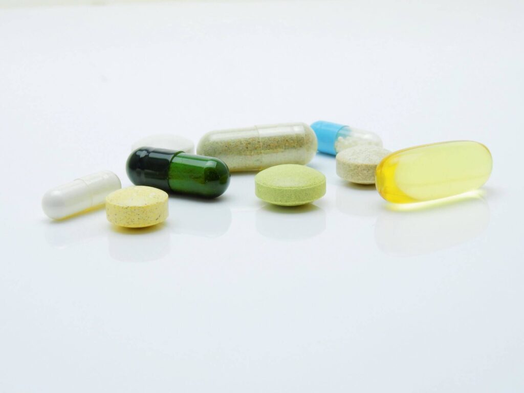 a group of pills and capsules
