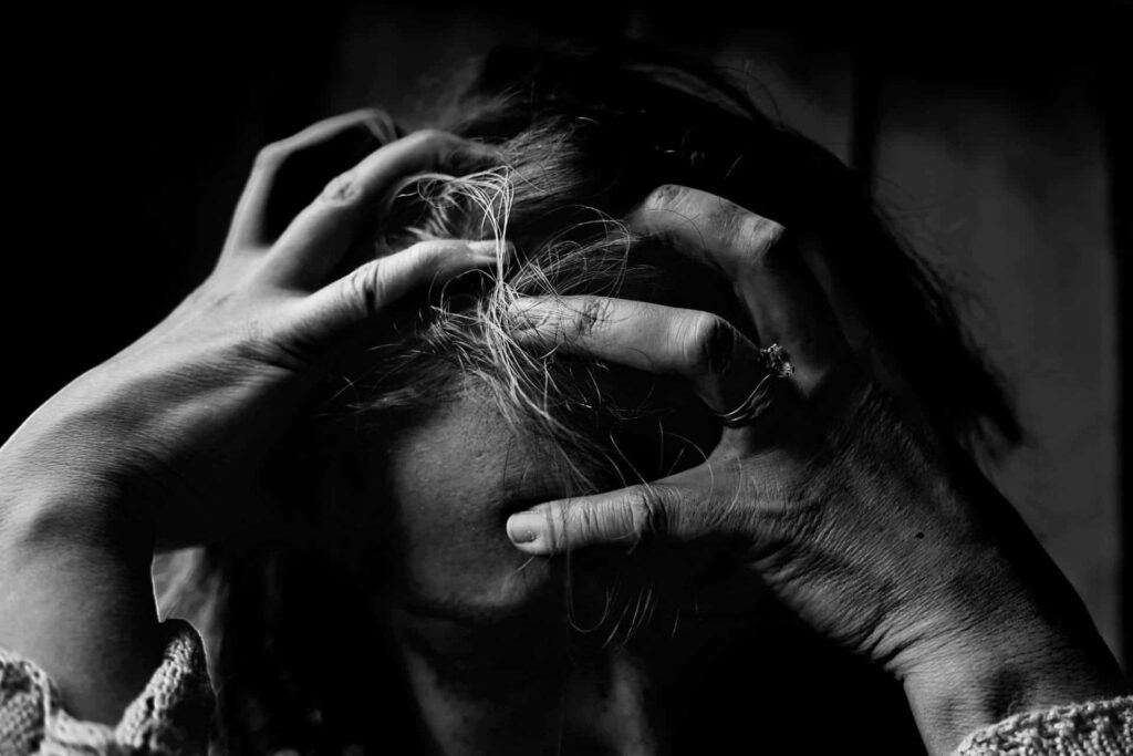 a person holding their hair