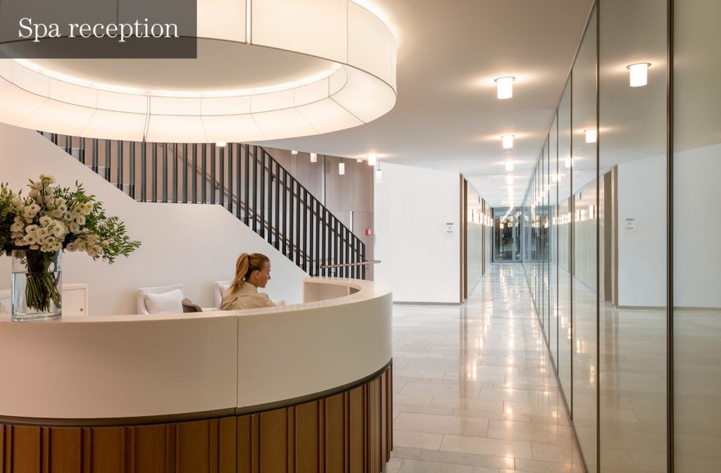 a woman sitting at a reception desk