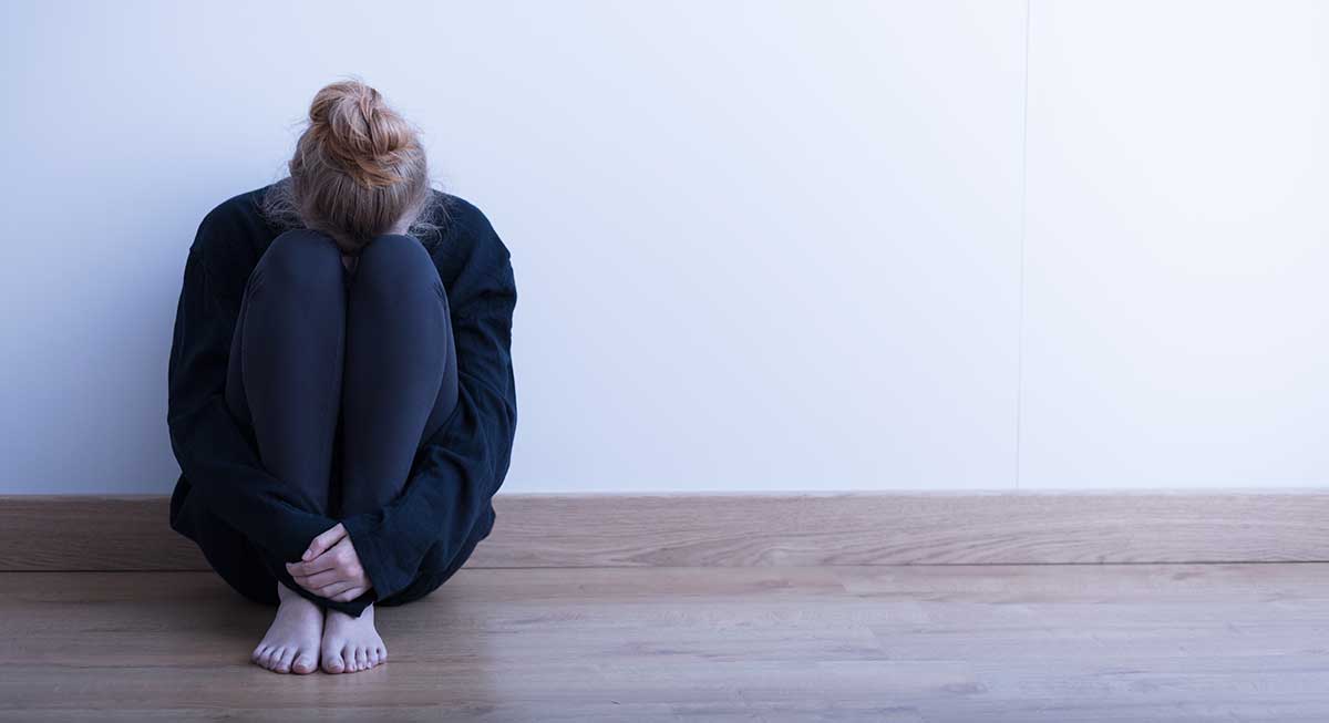 a woman sitting on the floor