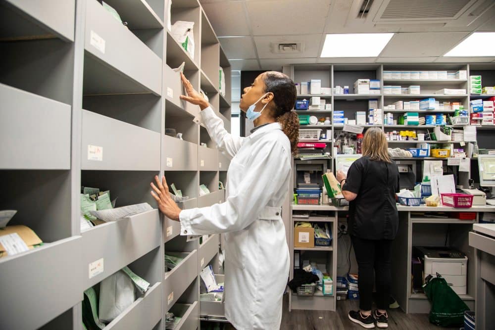 pharmacist filling prescription